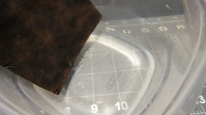 aging leather through rubbing alcohol