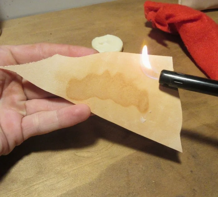 burning wax into leather to age